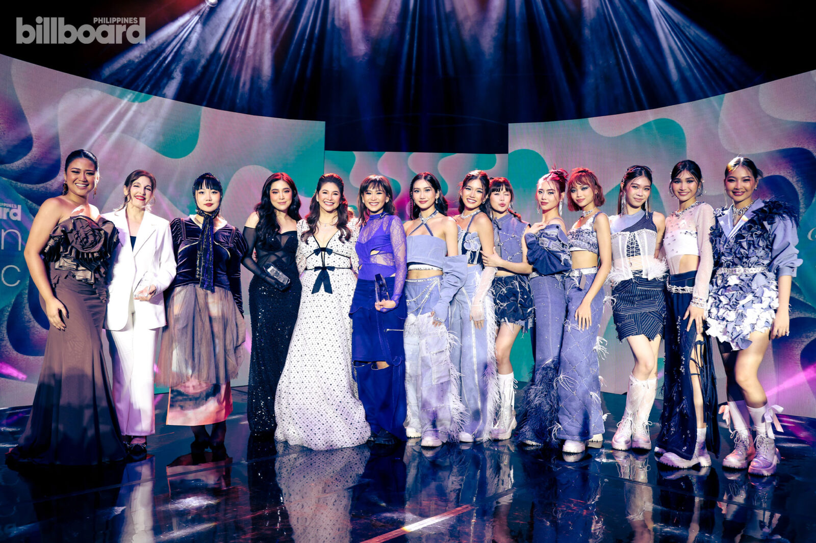 (From left to right) Morissette, Jackie Lou Blanco, Ena Mori, Moira, Regine Velasquez-Alcasid, Sarah Geronimo, and Sheena, Aiah, Maloi, Mikha, Gwen, Stacey, Jhoanna, and Colet of BINI at Billboard Philippines Women In Music 2024.