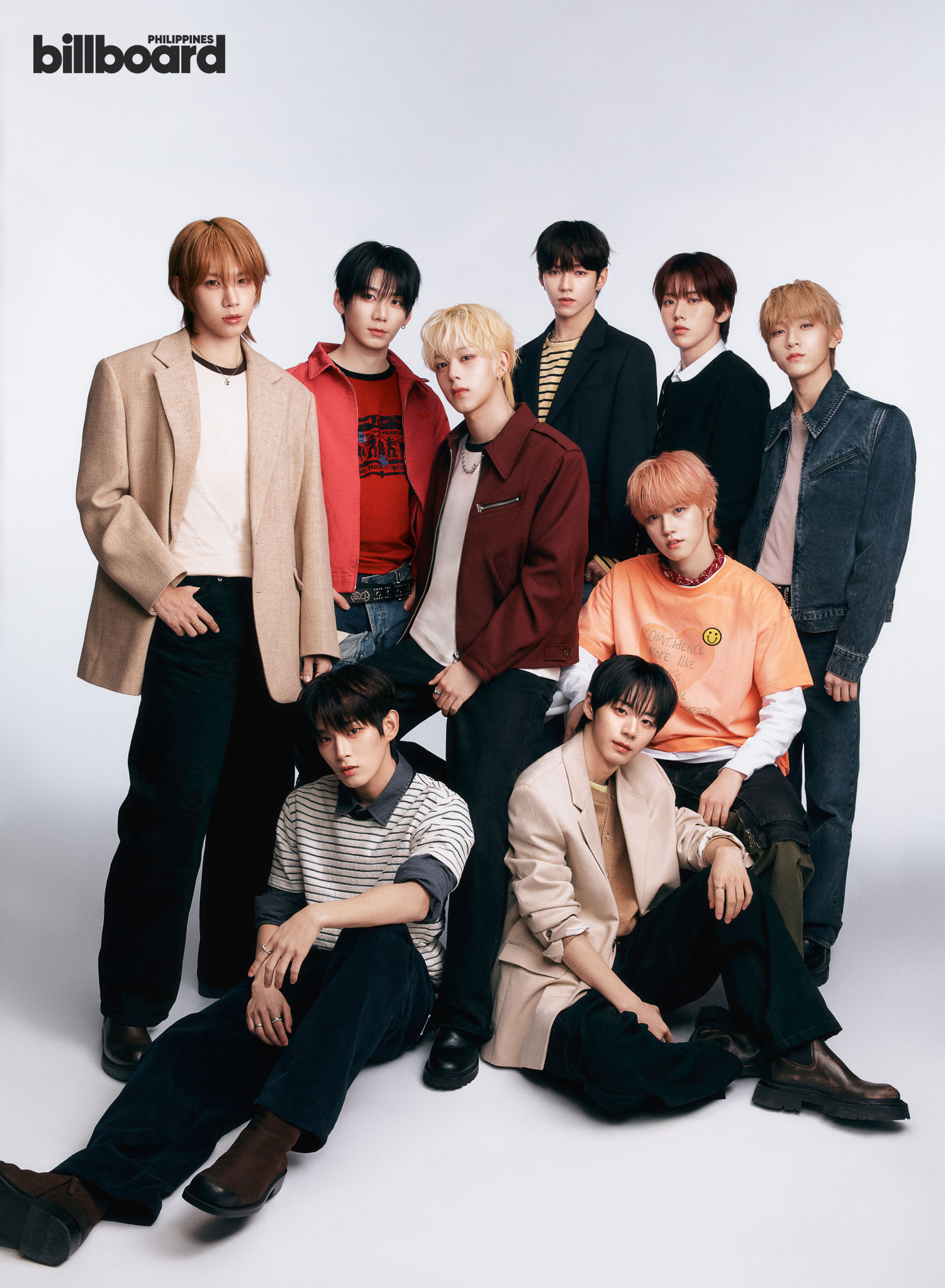 Seven members of a boy band posing together against a light backdrop, stylish casual outfits and varied hair colors, Billboard Philippines logo in top-left.