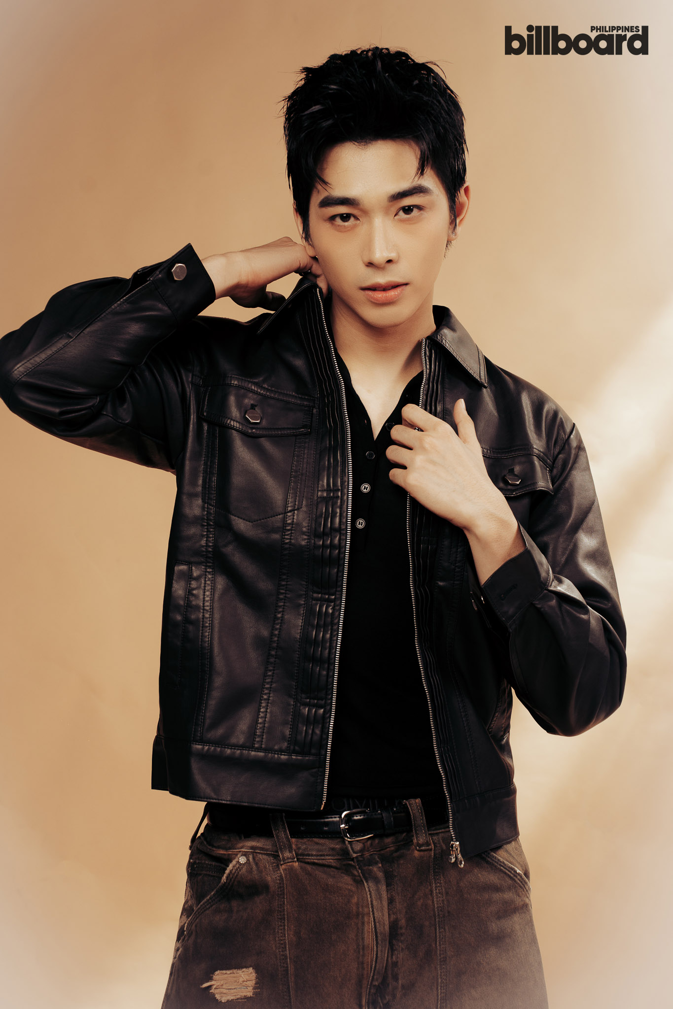 Young man in a black leather jacket posing against a warm beige backdrop; Billboard Philippines logo in the top-right corner.