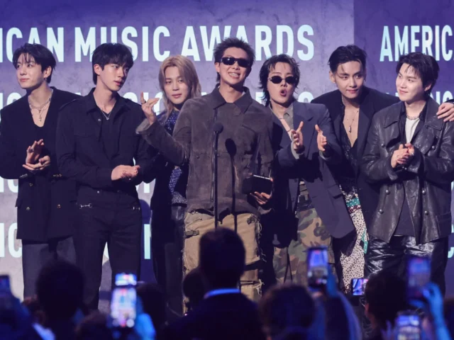 BTS receiving their 'Artist of the Year' award at the 2026 American Music Awards